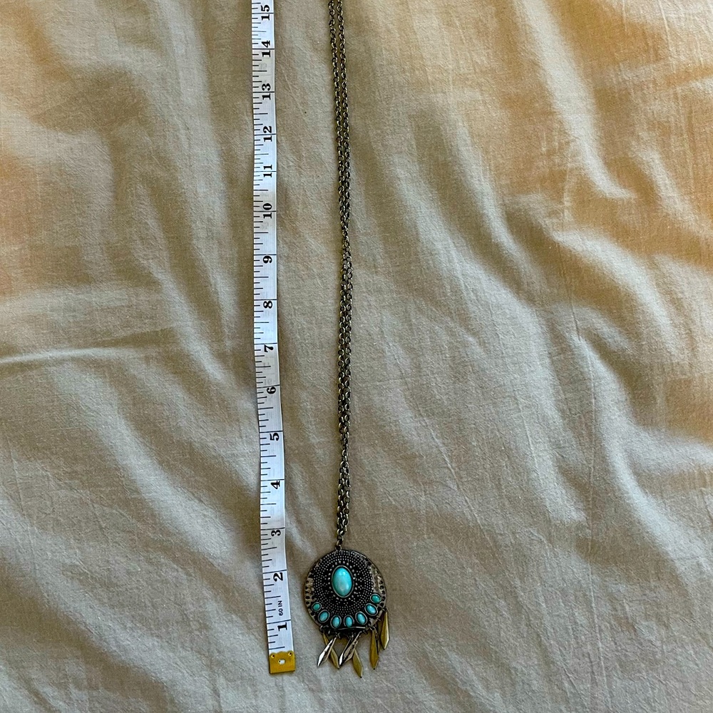 Long medallion statement necklace
